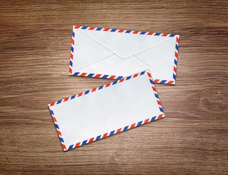 Mail envelopes on wooden floor