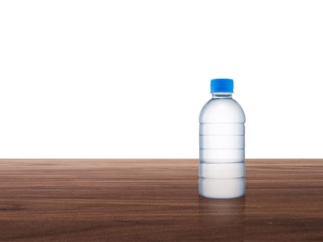 Plastic water bottle on wooden table