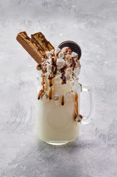 Milkshake with vegetable whipped cream foam, marshmallow and caramel