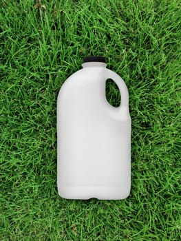 top view of milk bottle on the grass