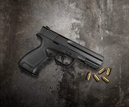 Bullets and pistols on cement floor