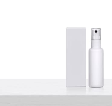 Plastic spray bottles blank and packaging on white wooden table. for packaging design