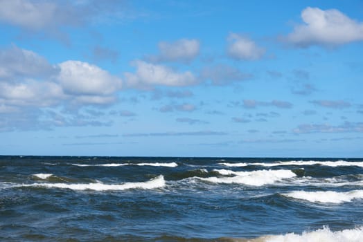 Beautiful sky and sea with waves to the horizon.