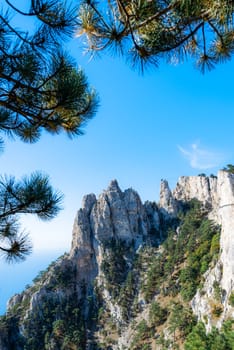 Majestic mountain landscape under the morning sky. Mountains, forest, sky, clouds, mountain peaks sea