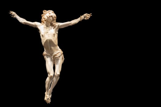 Jesus Christ - Old crucifix, Catholic Church, on black background with copy space