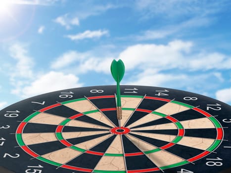Darts with dartboard with blue sky background concept for hitting target, goal and success