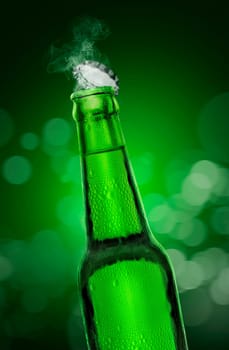 Cold wet open beer bottle with smoke on green bokeh background. 3d render