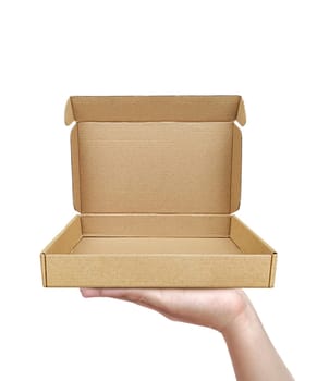 Empty cardboard box with copy space in the male hands on the white background