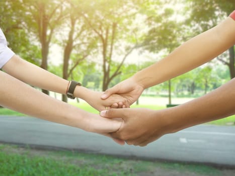 Image of a couple holding hands in a park
