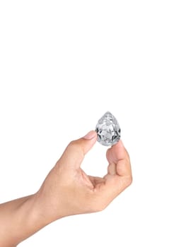 Hand holding diamond isolated on white background