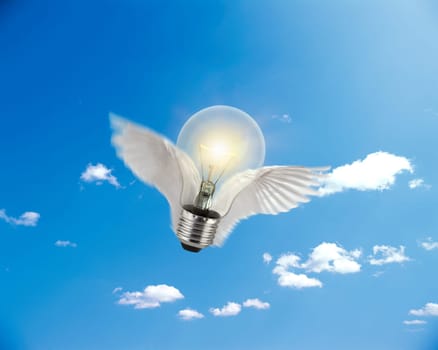 flying light bulb on sun and sky background. technology Concept