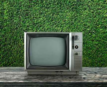 Old television vintage on wooden with black background, Retro, vintage TV style
