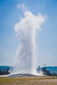 Old Faithful Geyser Erupting at Yellowstone National Park.