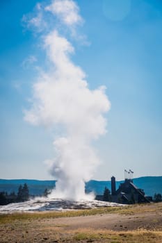 Old Faithful Geyser Erupting at Yellowstone National Park.