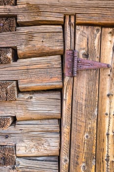 Abstract of Vintage Antique Log Cabin Wall and Door with Hinge.