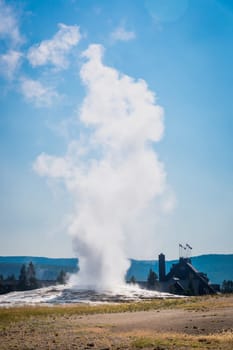 Old Faithful Geyser Erupting at Yellowstone National Park.