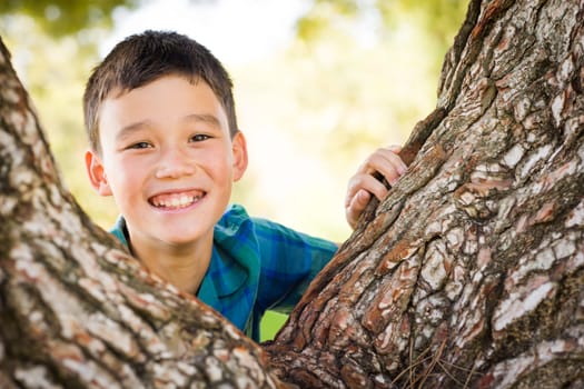 Outdoor portrait of a biracial Chinese and Caucasian boy.