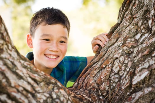 Outdoor portrait of a biracial Chinese and Caucasian boy.