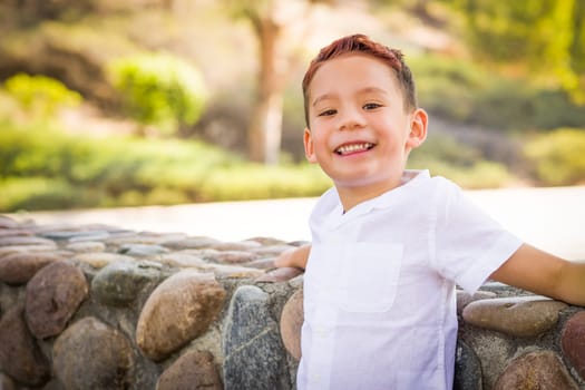 Outdoor portrait of a biracial Chinese and Caucasian boy.