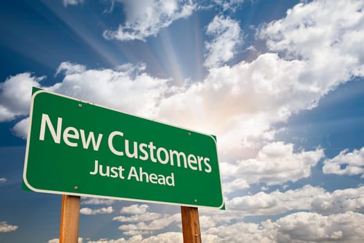 New Customers Green Road Sign Over Sunny Dramatic Clouds and Sky.