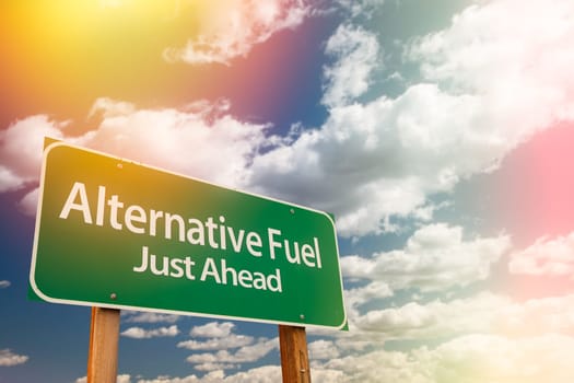 Alternative Fuel Green Road Sign Against Cloudy Sky.
