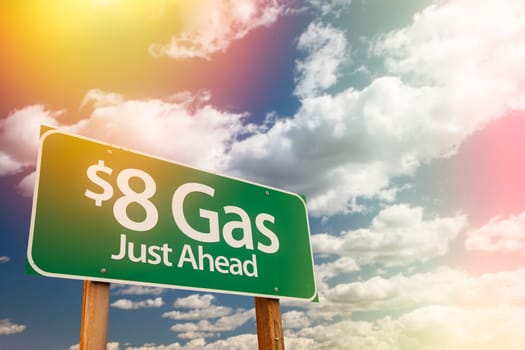 $8 Gas Green Road Sign Against Cloudy Sky.