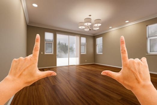 Female Hands Framing Empty Room of New House.