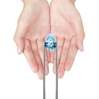 blue diamonds held in tweezers on a white background
