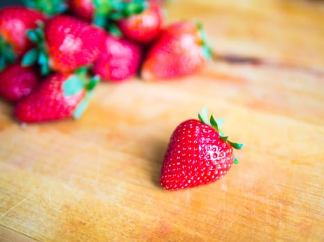 Fresh strawberry on a wooden board