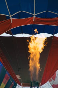 Showing the top of the furnace and the flame that provides hot air to fill the balloon.