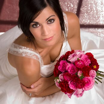 Above Beautiful Female Bride White Gown Holding Floral Bouquet