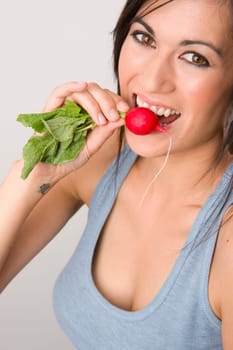 Happy Healthy Woman Bites into Fresh Radish
