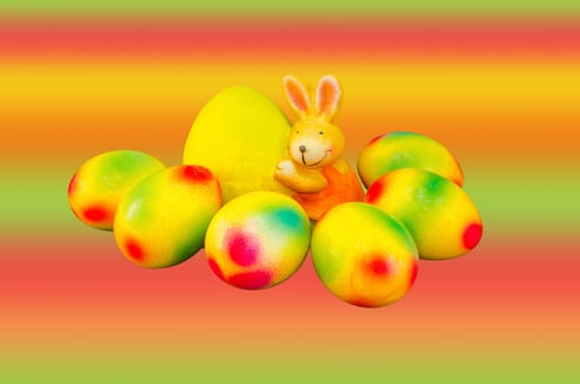 Easter bunny,self-painted Easter eggs and colorful background.