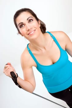 Vertical compositon of happy female working out to tone her body