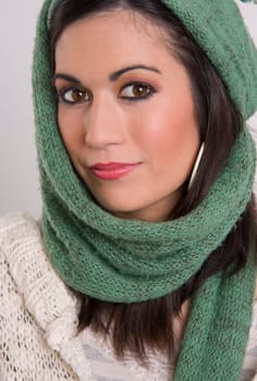 A beautiful woman wrapped in knitted material