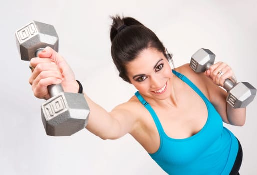 A Brunette Beauty lifts 10 Pound Barbells