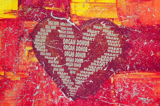 Acrylic painting by our daughter.. Hand painted large red heart with colorful background. With inscription Organ Donor.