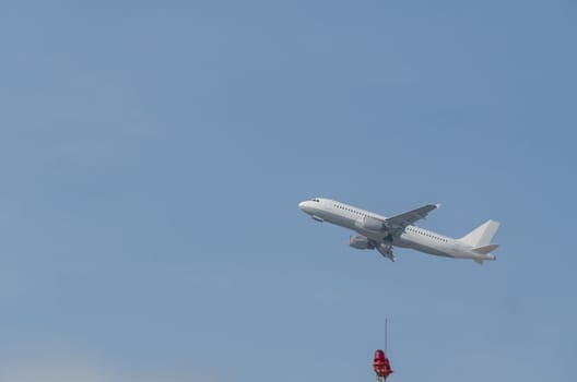 Side view passenger aircraft during take-off.