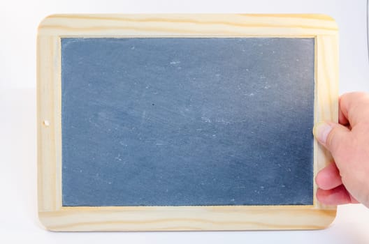 Hand holding an empty board against a white background.