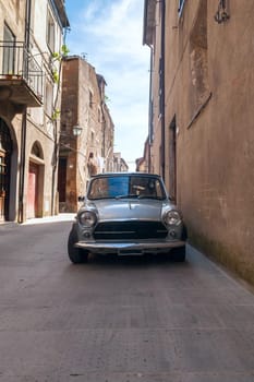 old retro car in the narrow streets of the old Italian city