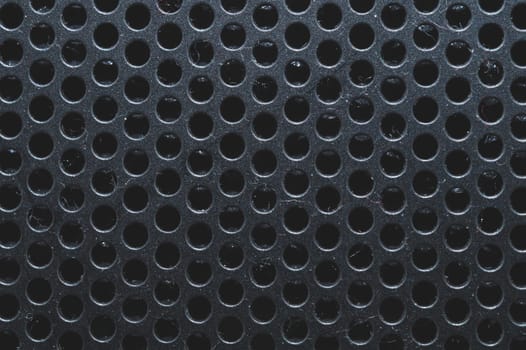 Dusty ventilation grid with round holes macro
