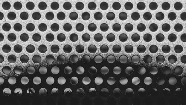 Gray metal grate with round holes. ventilation mesh