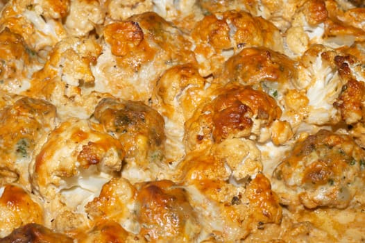 Baked cauliflower with cheese close up