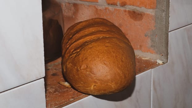 Long loaf in the ordinary stone stove close up