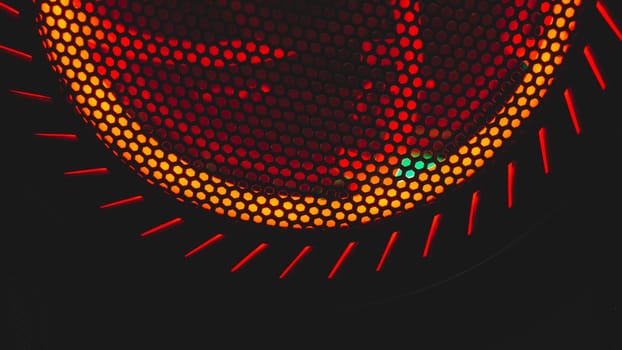Detail of computer fan with red light abstract background. cooler grid close up. rgb led illumination
