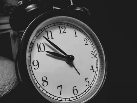 Retro black round alarm clock close up