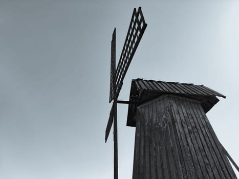 Old wooden windmill. rural building. black and white