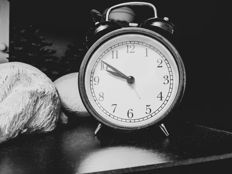 Retro black round alarm clock close up