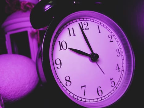 Retro black round alarm clock close up