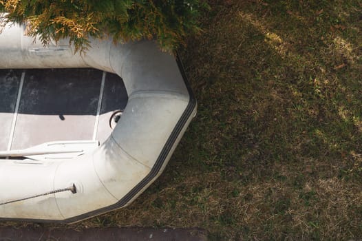 Inflatable boat on the green grass